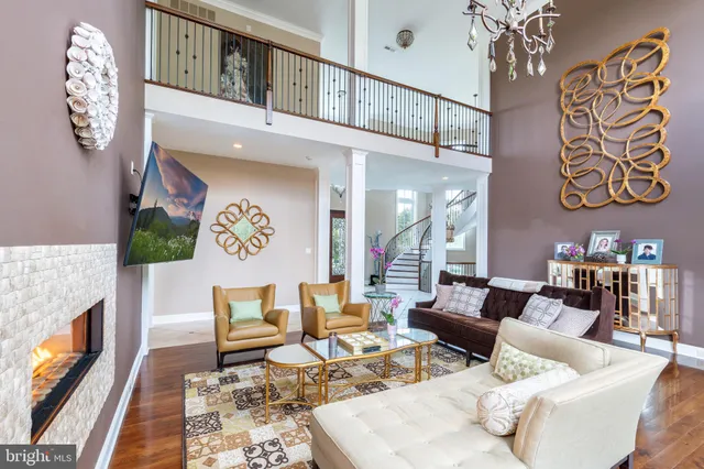 a living room with furniture a rug and a fireplace