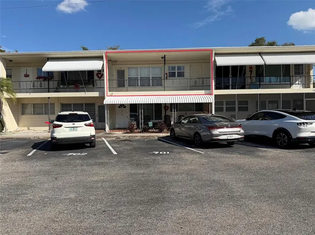 a view of a car parked in front of a building