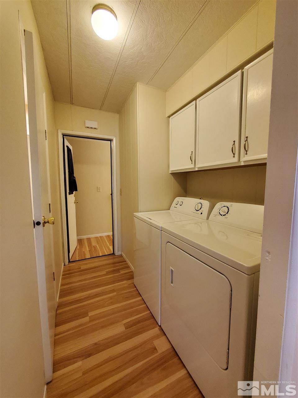 185 Aries Circle Reno, NV 89521 - Photo 12 of 18 a view of a storage & utility room with dryer and washer