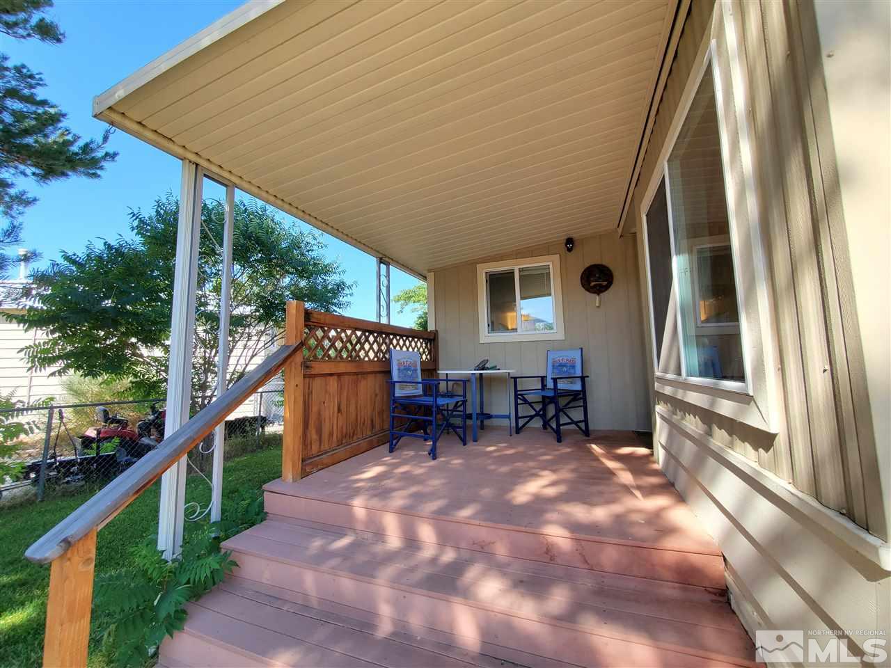 185 Aries Circle Reno, NV 89521 - Photo 16 of 18 a backyard of a house with table and chairs