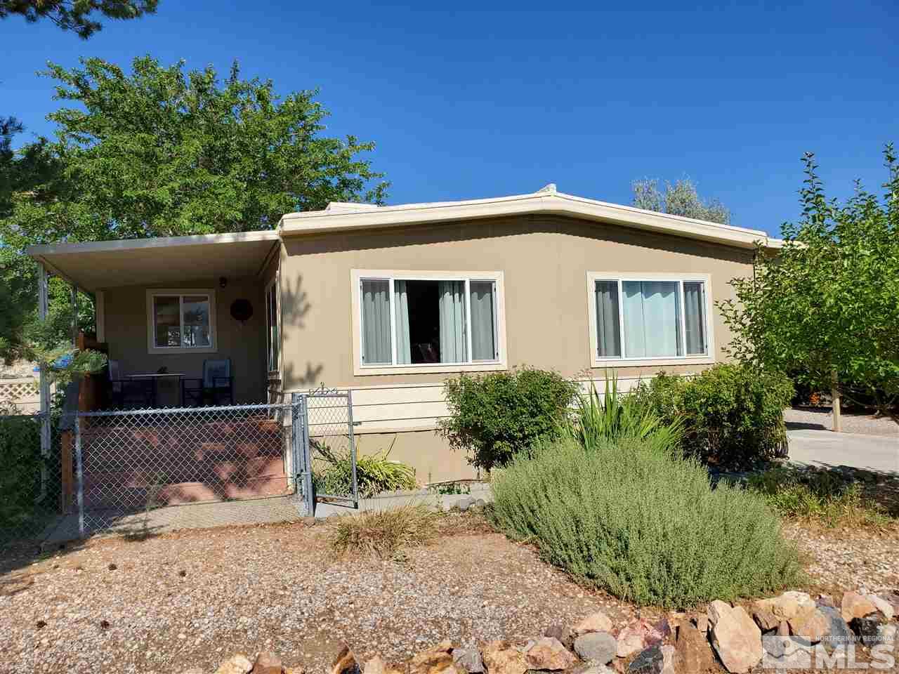 185 Aries Circle Reno, NV 89521 - Photo 2 of 18 a front view of a house with a yard