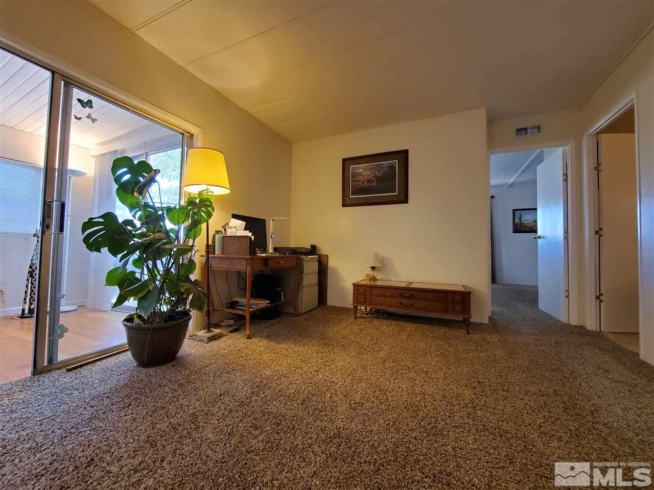 185 Aries Circle Reno, NV 89521 - Photo 7 of 18 a lobby with furniture and potted plant