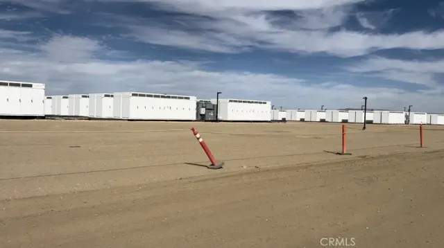 a view of a brick building next to a road