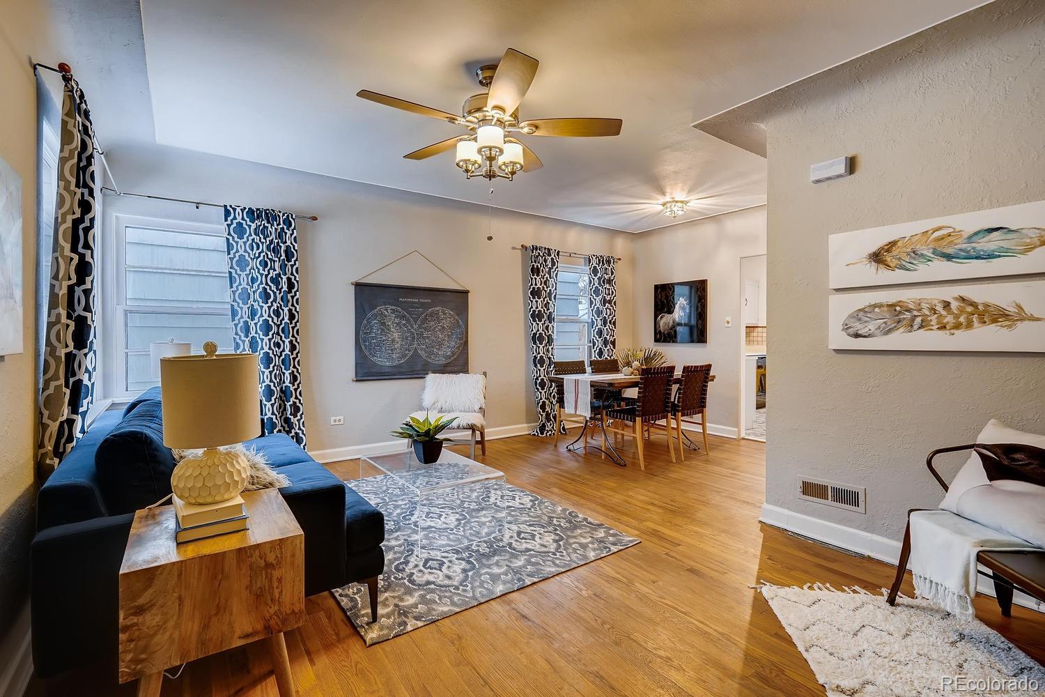 4739 Stuart Street Denver, CO 80212 - Photo 1 of 25 a living room with furniture and wooden floor