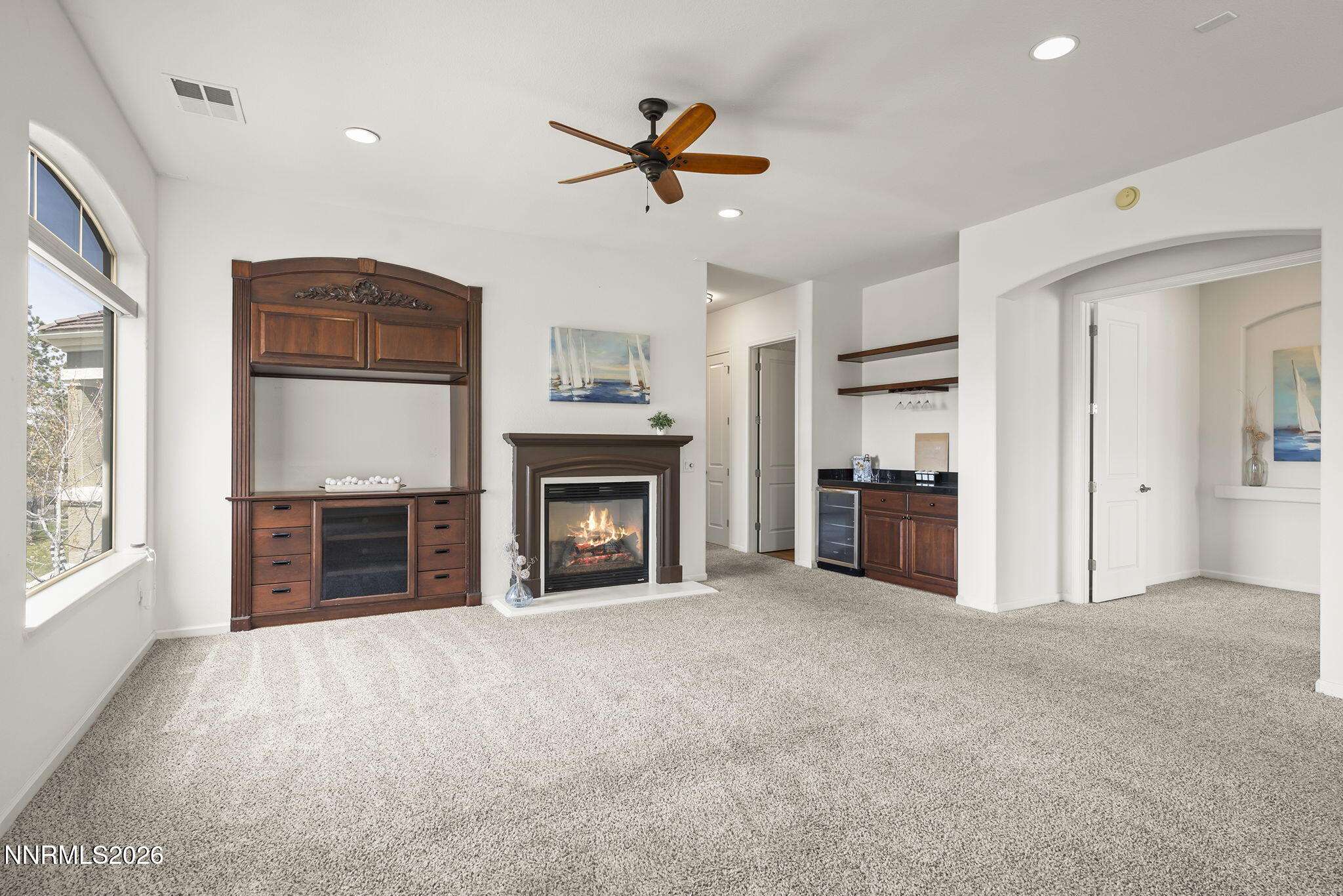 9900 Wilbur May Parkway, Unit 304 Reno, NV 89521 - Photo 7 of 47 a view of empty room with a fireplace and cabinet