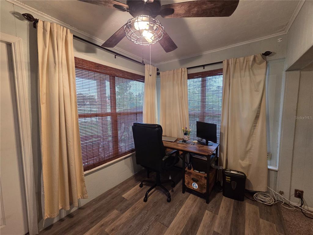 124 East F Street Frostproof, FL 33843 - Photo 7 of 37 a view of a workspace with furniture and a window