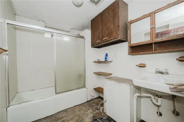 a view of cabinets and wooden floor