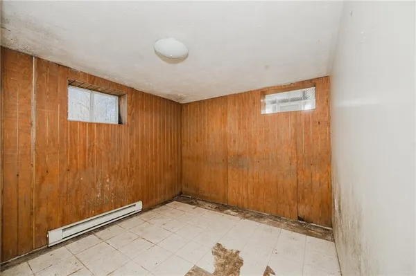 a view of an empty room with wooden door