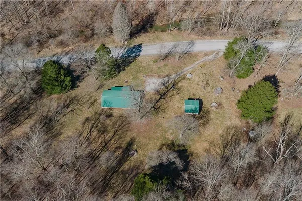 an aerial view of residential house with outdoor space