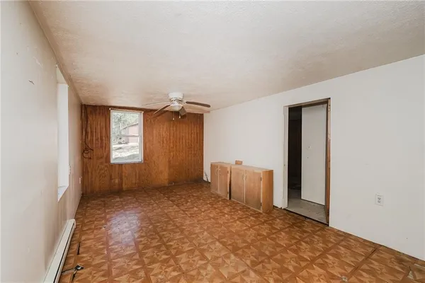 a view of empty room with windows
