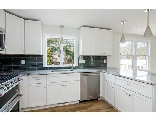 4 Tabor Road Sandwich, MA 02644 - Photo 8 of 21 a kitchen with granite countertop white cabinets white appliances and a sink