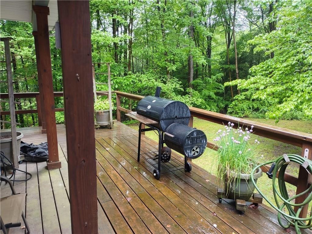 399 Long Road Utica, PA 16362 - Photo 14 of 17 a view of balcony with wooden floor and outdoor seating
