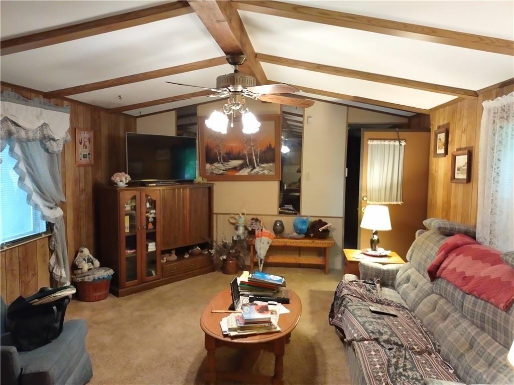 399 Long Road Utica, PA 16362 - Photo 4 of 17 a living room with furniture and a flat screen tv