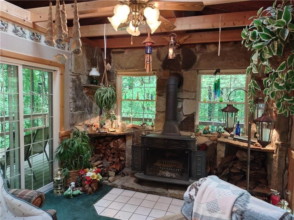 399 Long Road Utica, PA 16362 - Photo 6 of 17 a view of backyard with outdoor seating and green space