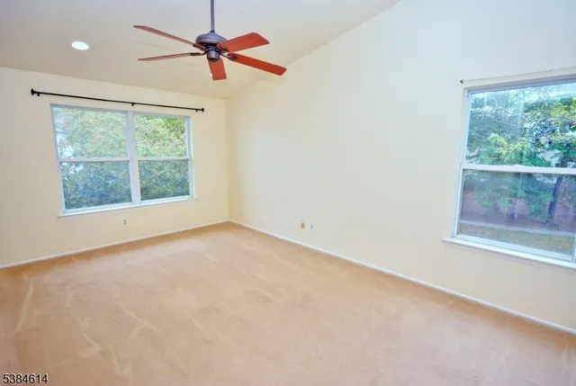 a bathroom with a sink mirror and a shower