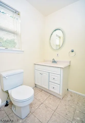 a bathroom with a bathtub and a toilet