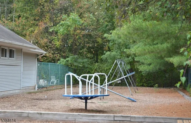a view of an empty room with a fireplace