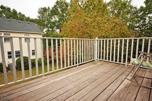 a balcony with wooden floor