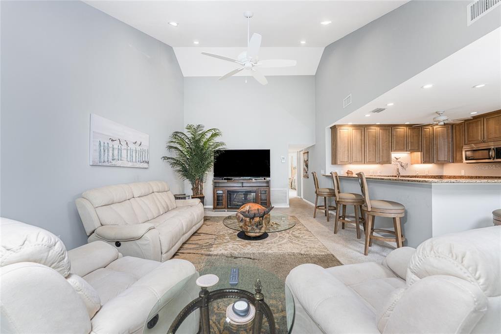 1401 Beach Road, Unit 303 Englewood, FL 34223 - Photo 12 of 63 a living room with furniture and a flat screen tv