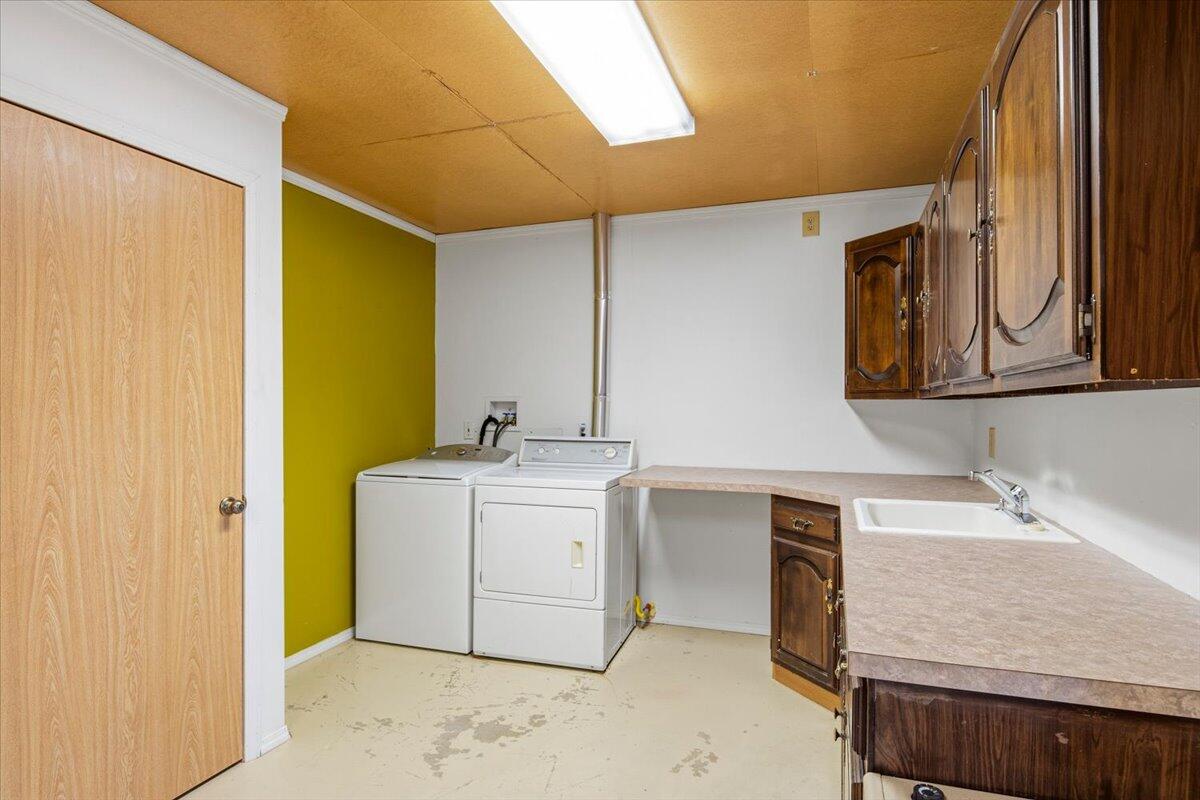 11182 Southwest Dynamite Lane Culver, OR 97734 - Photo 51 of 70 a utility room with a sink washer and dryer