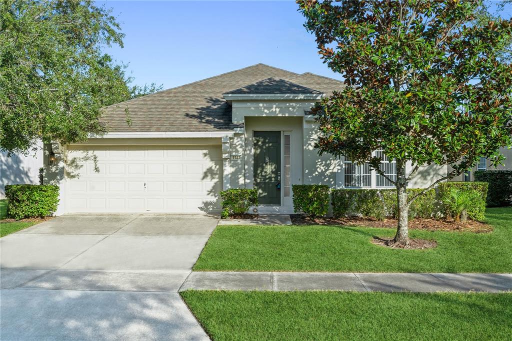 1131 Brant Point Orlando, FL 32828 - Photo 1 of 1 a front view of a house with a yard