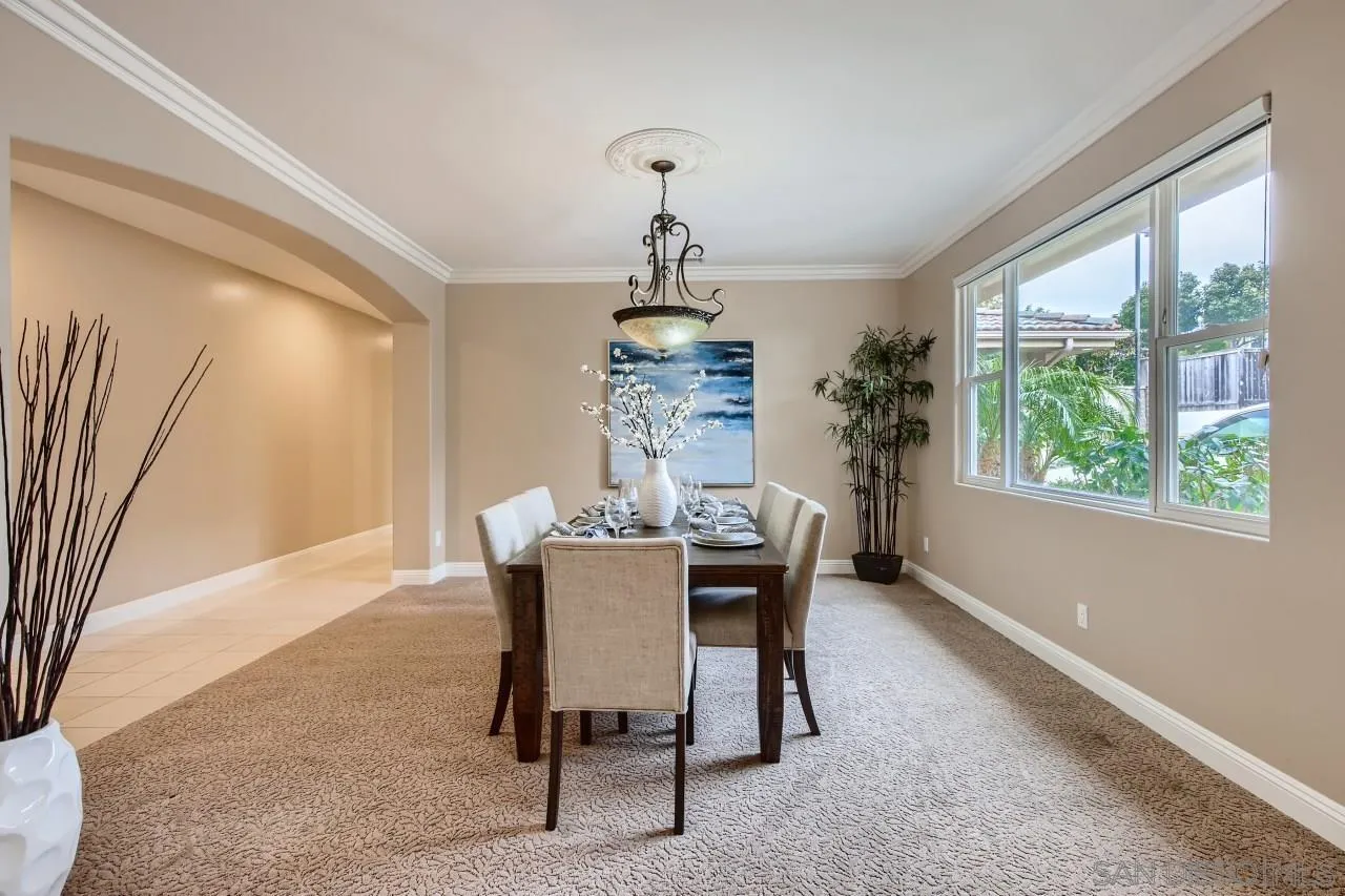 3965 Packard Lane Carlsbad, CA 92008 - Photo 11 of 32 a dining room with furniture a chandelier and window