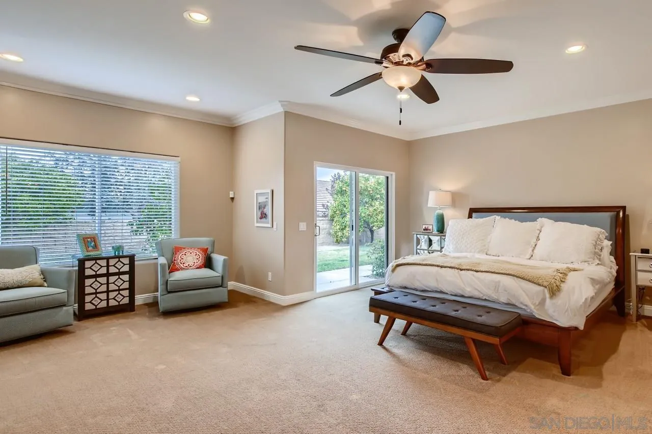 3965 Packard Lane Carlsbad, CA 92008 - Photo 14 of 32 a spacious bedroom with a bed and a couch