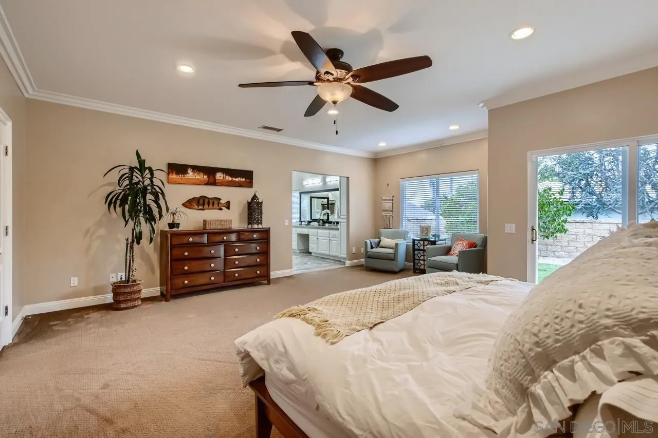 3965 Packard Lane Carlsbad, CA 92008 - Photo 15 of 32 a bed room with a bed and a large window