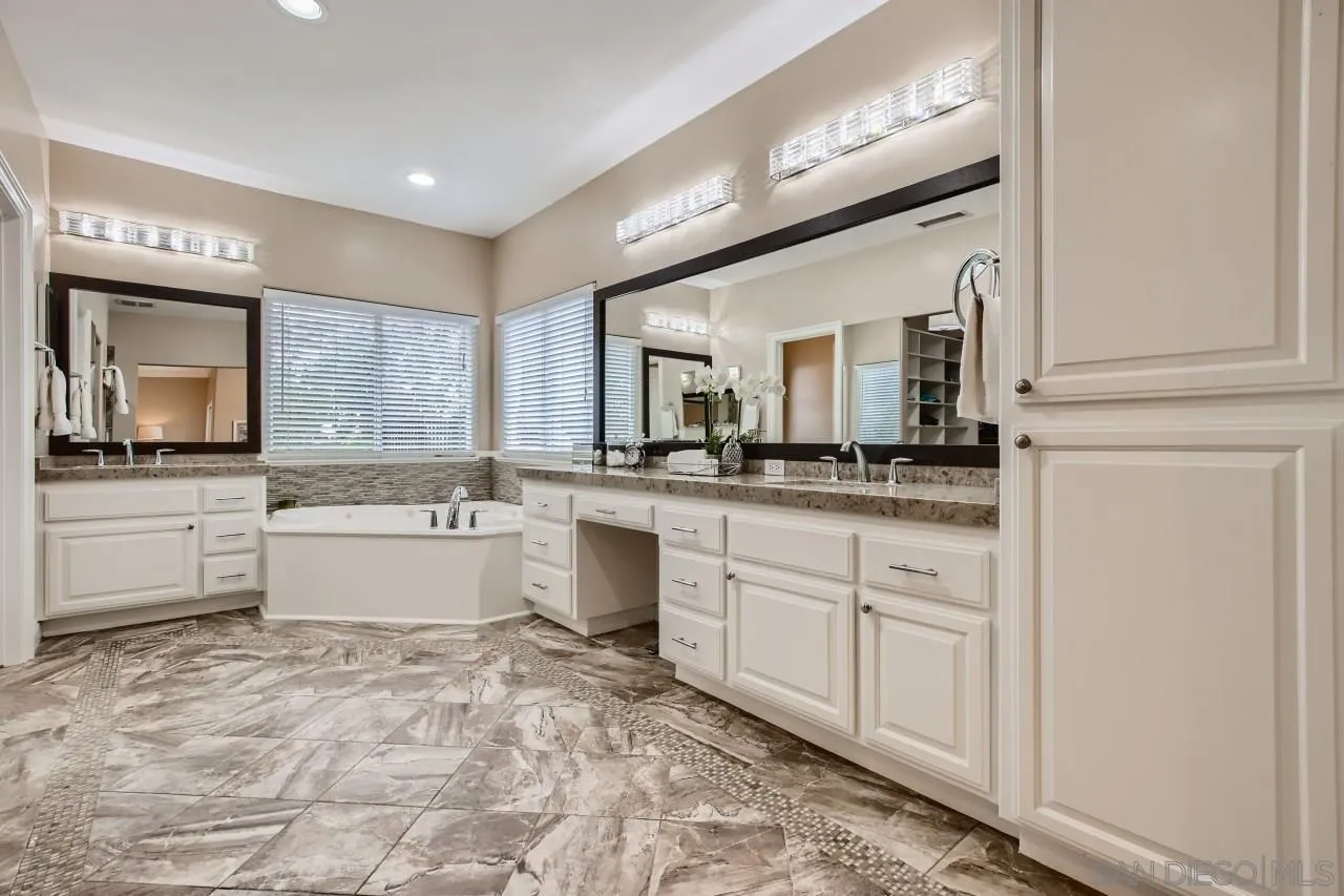 3965 Packard Lane Carlsbad, CA 92008 - Photo 16 of 32 a large bathroom with a large tub and sink