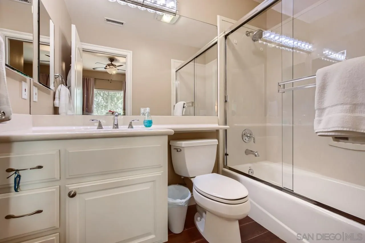 3965 Packard Lane Carlsbad, CA 92008 - Photo 19 of 32 a bathroom with a sink a toilet and shower