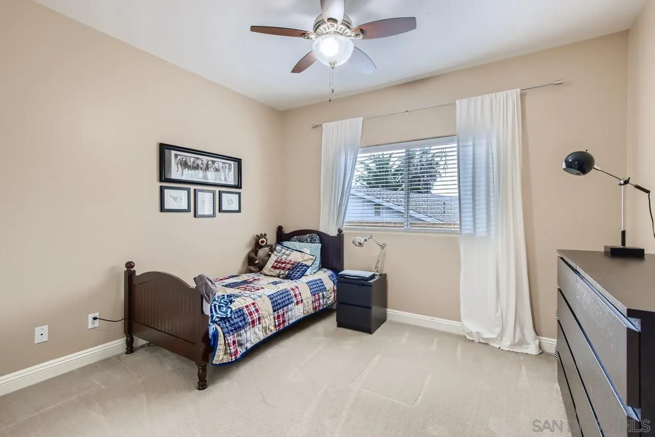 3965 Packard Lane Carlsbad, CA 92008 - Photo 20 of 32 a bedroom with bed and window