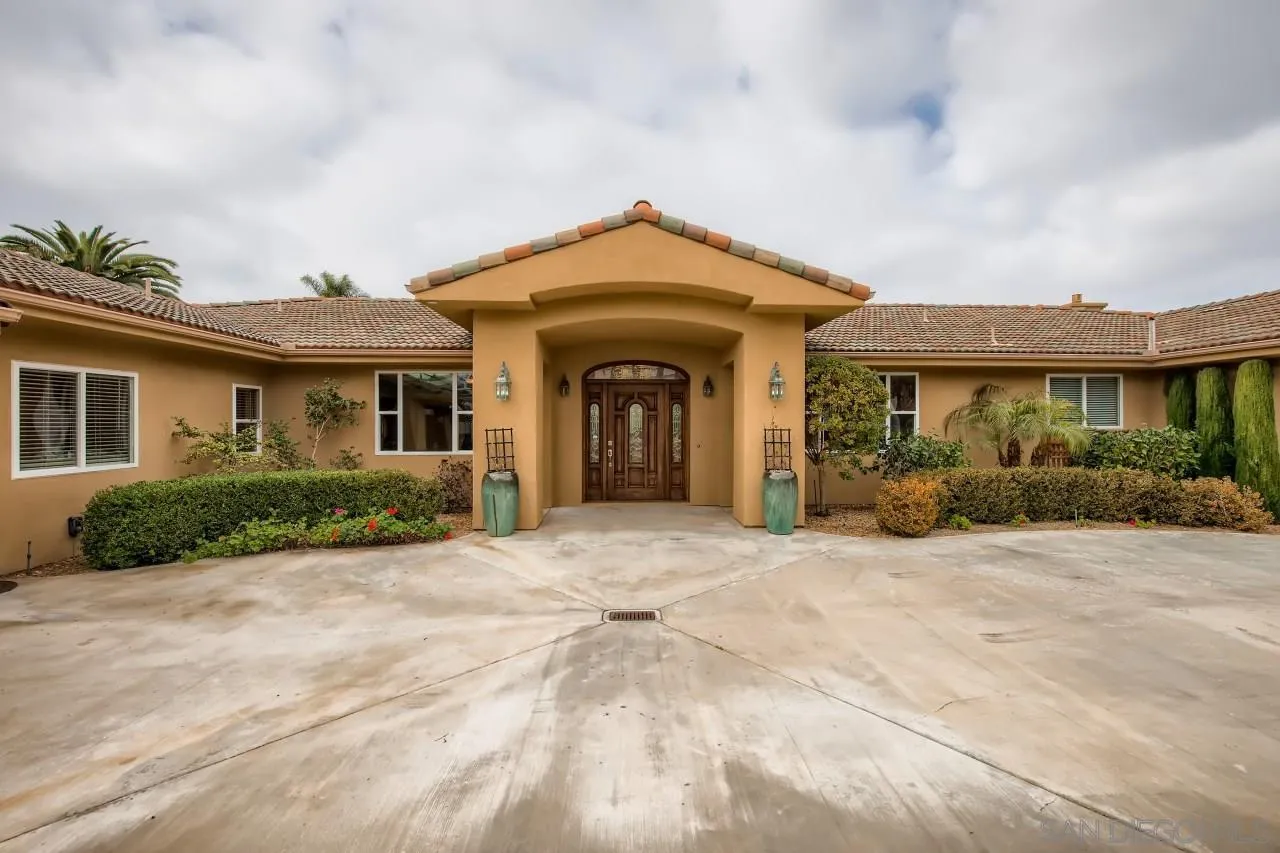 3965 Packard Lane Carlsbad, CA 92008 - Photo 2 of 32 a view of a house with yard and plants