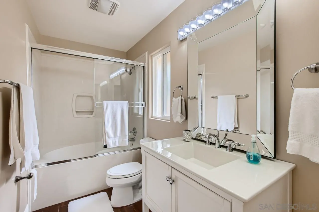 3965 Packard Lane Carlsbad, CA 92008 - Photo 24 of 32 a bathroom with a sink toilet tub and shower