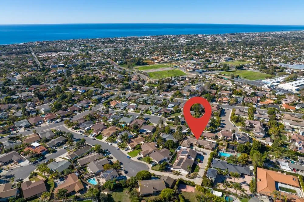3965 Packard Lane Carlsbad, CA 92008 - Photo 30 of 32 an aerial view of residential houses with outdoor space and swimming pool