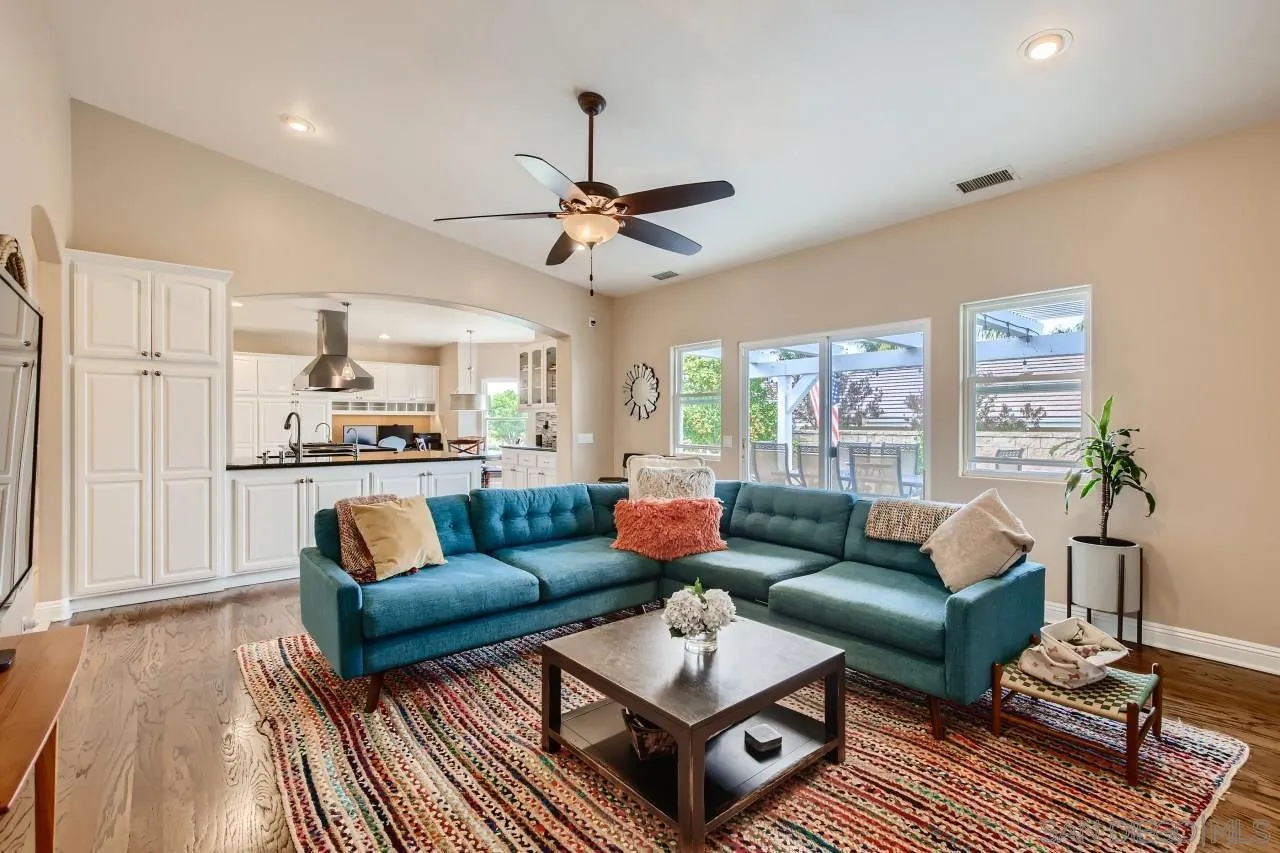 3965 Packard Lane Carlsbad, CA 92008 - Photo 7 of 32 a living room with furniture and a wooden floor