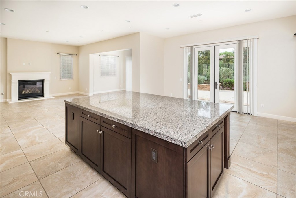 136 Long Fence Irvine, CA 92602 - Photo 12 of 26 a kitchen with granite countertop a sink and a counter top space