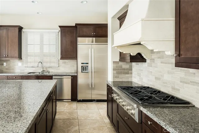 a view of empty room with a fireplace