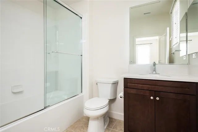 an empty room with a empty space and windows