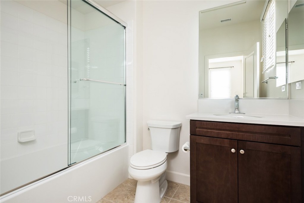 136 Long Fence Irvine, CA 92602 - Photo 17 of 26 a bathroom with a sink a toilet and shower