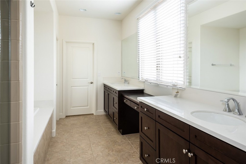 136 Long Fence Irvine, CA 92602 - Photo 20 of 26 a kitchen with a sink stove and cabinets
