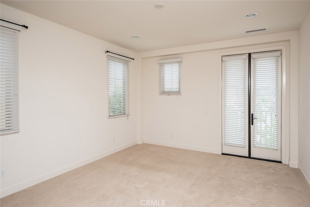 136 Long Fence Irvine, CA 92602 - Photo 21 of 26 an empty room with windows