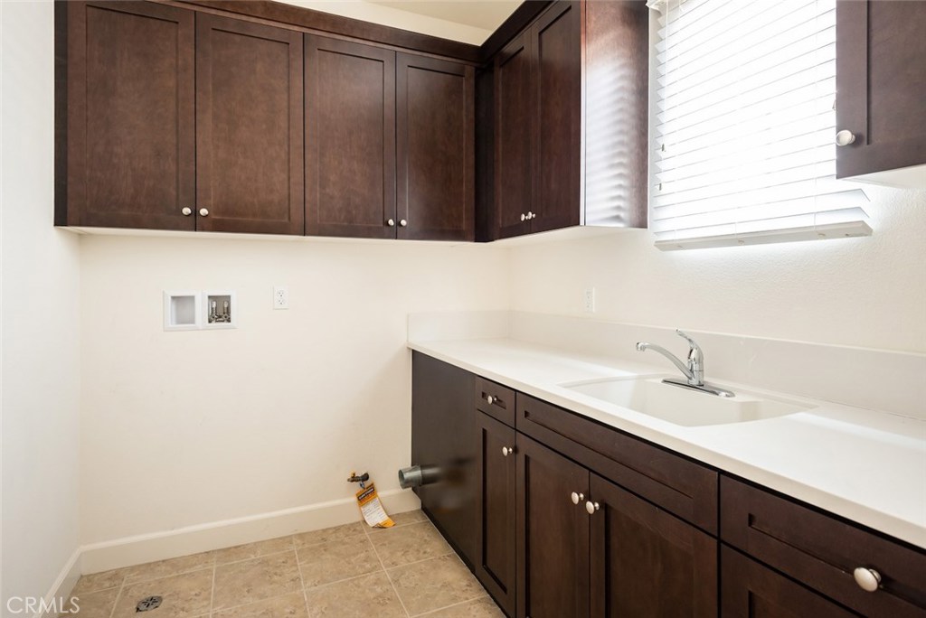 136 Long Fence Irvine, CA 92602 - Photo 23 of 26 a bathroom with a sink and a mirror