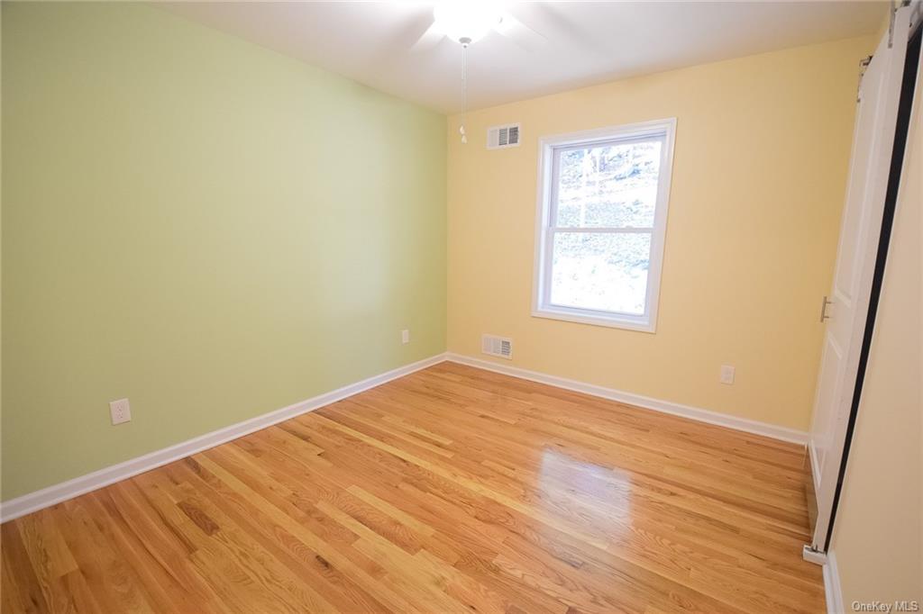 Lot #2 Old Forestburgh Road Sparrowbush, NY 12780 - Photo 11 of 17 an empty room with wooden floor and windows