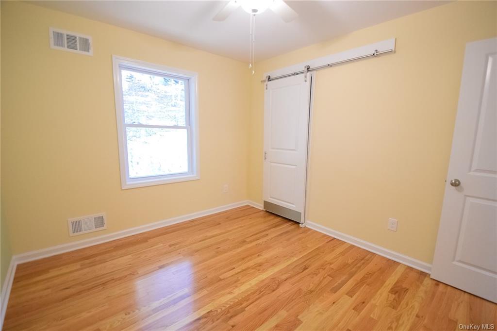 Lot #2 Old Forestburgh Road Sparrowbush, NY 12780 - Photo 12 of 17 an empty room with wooden floor and windows