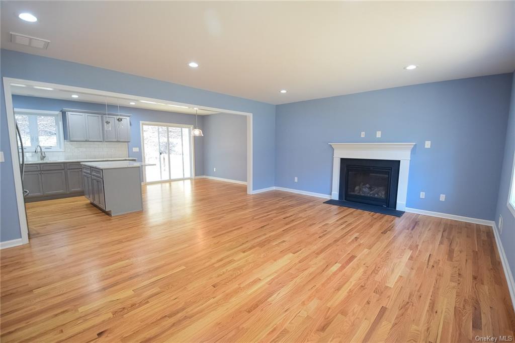 Lot #2 Old Forestburgh Road Sparrowbush, NY 12780 - Photo 3 of 17 a view of empty room with wooden floor and fireplace