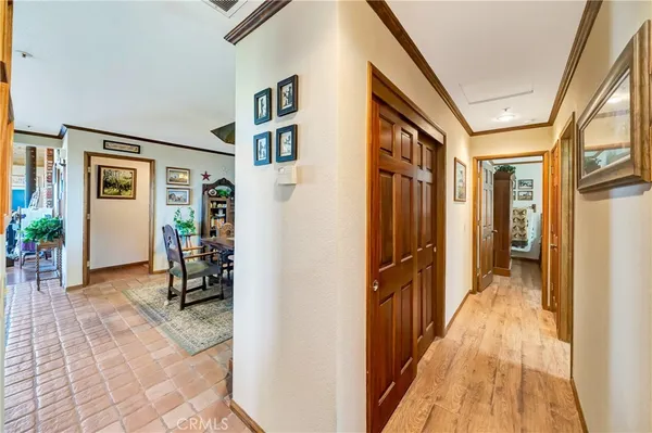 a dining room with stainless steel appliances a table and chairs
