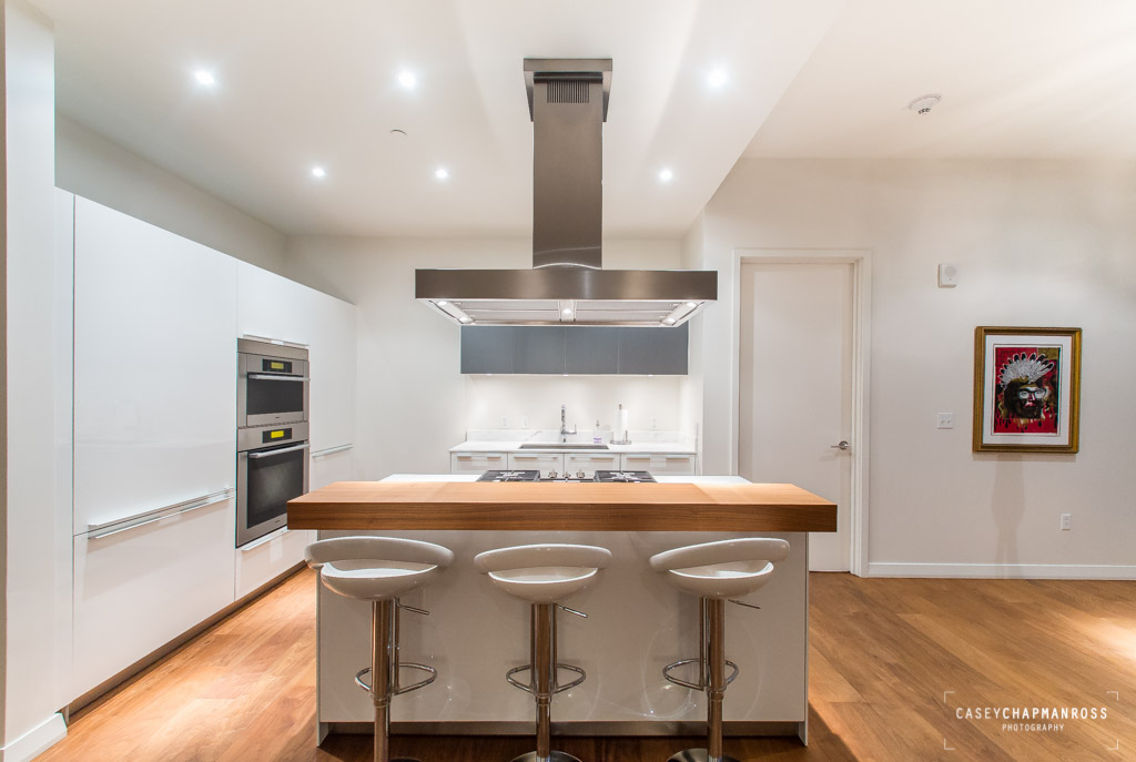 210 Lavaca Street, Unit 1910 Austin, TX 78701 - Photo 11 of 40 a kitchen with a stove and a table