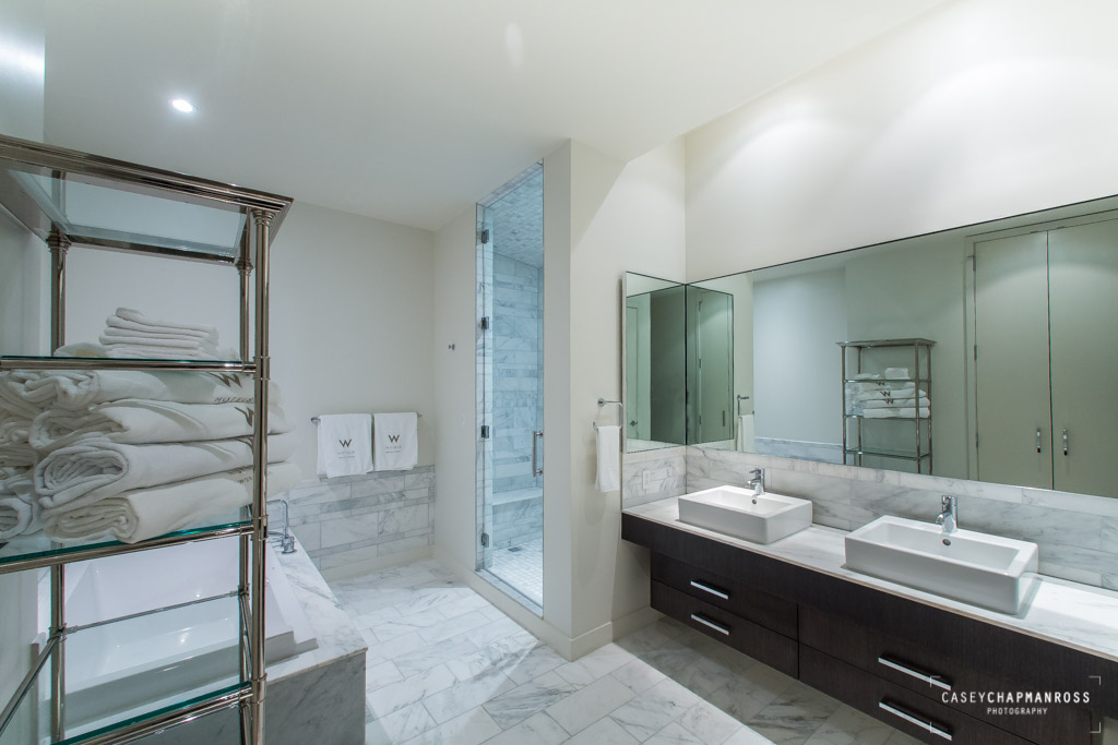 210 Lavaca Street, Unit 1910 Austin, TX 78701 - Photo 19 of 40 a spacious bathroom with a double vanity sink a mirror and a shower