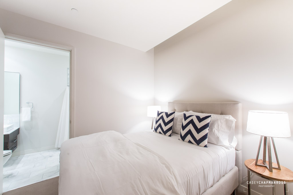 210 Lavaca Street, Unit 1910 Austin, TX 78701 - Photo 36 of 40 a bedroom with a bed and a lamp
