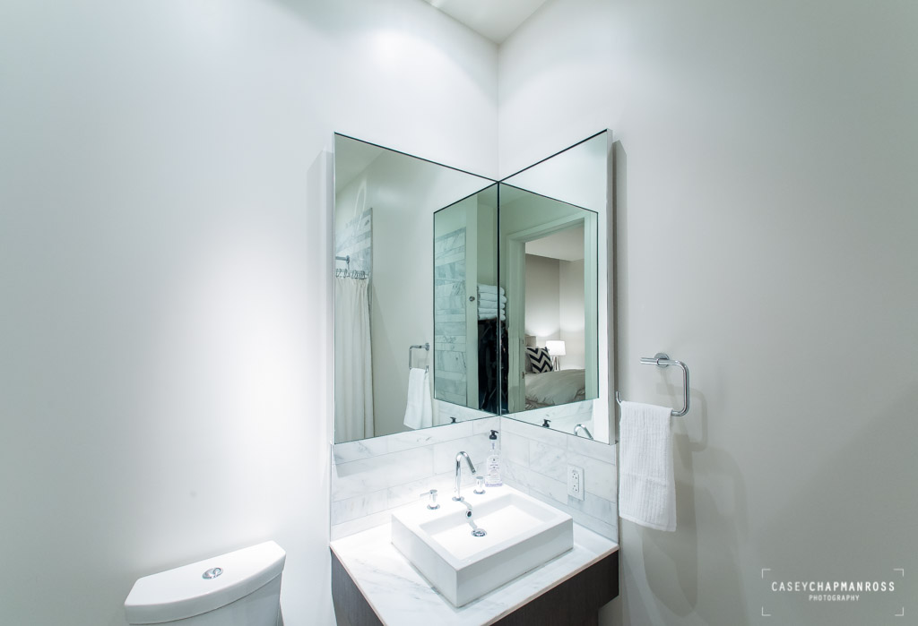 210 Lavaca Street, Unit 1910 Austin, TX 78701 - Photo 40 of 40 a bathroom with a sink and a mirror